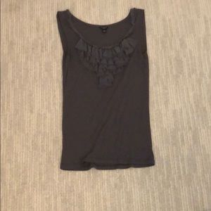 a top with ruffles on the middle